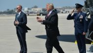 US President Donald Trump steps off Air Force One upon arrival at Palm Beach International Airport in West Palm Beach, Florida on April 16, 2018. AFP / MANDEL NGAN