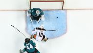 Corey Perry #10 of the Anaheim Ducks scores a goal between goalie Martin Jones #31 and Marc-Edouard Vlasic #44 of the San Jose Sharks, only to have it called off due to an offsides call during the third period in Game Four of the Western Conference First 