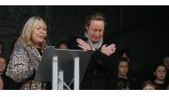 Cynthia and Julian Lennon at the unveiling of the John Lennon Peace Monument in Chavasse Park, Liverpool on 9th October 2010 with the Liverpool Signing Choir in the background. Celebrating peace and the loving memory of John Lennon on what would have been