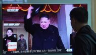 A man watches a television news showing a file footage of North Korean leader Kim Jong Un, at a railway station in Seoul on April 21, 2018. AFP / Jung Yeon-je