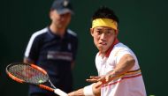 Japan's Kei Nishikori returns the ball to Germany's Alexander Zverev during their men's single semi-final tennis match at the Monte-Carlo ATP Masters Series tournament on April 21, 2018, in Monaco. AFP / YANN COATSALIOU