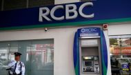 A security guard stands guard outside a branch of Rizal Commercial Banking Corporation in Paranaque city, Metro Manila, Philippines, August 2, 2016. Reuters/Erik De Castro