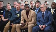 Waffle House patron James Shaw, Jr. (C) who stopped the shooting at a Waffle House where a gunman opened fire killing four and injuring two attends a press conference with FBI Special Agent In Charge, Matthew Espenshade (L) and Metro Nashville Mayor David