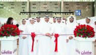 H E Dr Mohammed bin Saleh Al Sada (fourth left), Minister of Energy and Industry; H E Sheikh Abdullah bin Saud Al Thani (second right), QCB Governor;  Abdulaziz bin Nasser Al Khalifa (right), CEO of Qatar Development Bank, and other officials during the i