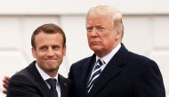 French President Emmanuel Macron (L) and U.S. President Donald Trump embrace during the official arrival ceremony for Macron on the South Lawn of the White House in Washington, U.S., April 24, 2018. Reuters/Jonathan Ernst