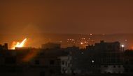 A picture taken in the Yarmuk Palestinian refugee camp in southern Damascus on April 24, 2018 shows fire billowing in the area during Syrian army shelling. / AFP / Rami al SAYED