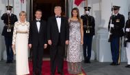 US President Donald Trump and First Lady Melania Trump welcome French President Emmanuel Macron and his wife, Brigitte Macron, as they arrive for a State Dinner at the North Portico of the White House in Washington, DC, April 24, 2018. AFP / SAUL LOEB