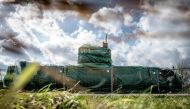 The homemade submarine UC3 Nautilus as it is covered with green tarpaulin in Nordhavn, a harbour area in Copenhagen, Denmark on April 25, 2018.  AFP / Ritzau Scanpix / Mads Claus Rasmussen