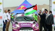 Prince Feisal Al Hussein flags Nasser Saleh Al Attiyah from the starting point  of the Jordan Rally yesterday.