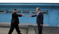 South Korean President Moon Jae-in (R) and North Korean leader Kim Jong-un (L) meet at the Military Demarcation Line of the truce village of Panmunjom, South Korea on April 27, 2018. Kim Jong-un is the first North Korean leader to enter South Korea since 