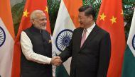 Chinese President Xi Jinping (R) shakes hands with Indian Prime Minister Narendra Modi during their visit at East Lake Guest House, in Wuhan, China, April 27, 2018. India's Press Information Bureau/Handout via Reuters
