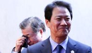 Suh-hoon, South Korea's chief of the National Intelligence Service (NIS) cries after delivering a joint statement, next to Im Jong-seok, South Korea's chief presidential secretary, at the truce village of Panmunjom inside the demilitarized zone separating