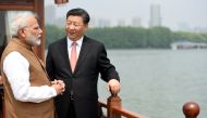 India's Prime Minister Narendra Modi speaks with Chinese President Xi Jinping as they take a boat ride on the East Lake in Wuhan, China, April 28, 2018. India's Press Information Bureau/Handout via REUTERS 