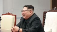 This picture taken on April 27, 2018 and released from North Korea's official Korean Central News Agency (KCNA) on April 29, 2018 shows North Korea's leader Kim Jong Un speaking with South Korea's President Moon Jae-in (unseen) during the Inter-Korean sum