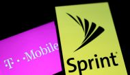Smartphones with the logos of T-Mobile and Sprint are seen in this illustration taken September 19, 2017. Reuters/Dado Ruvic