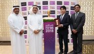 Qatar Football Association (QFA) and Fifty One East and Sony Middle East and Africa (Sony MEA) officials pose for a photographs with the Emir Cup. 