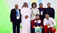 Qatar’s Faris Hassouna poses for a picture after winning three gold medals at the Asian Youth and Junior Weightlifting Championship in Uzbekistan on Sunday.