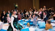 The character Uccellina, played by Charlotte Hoather, performs for children and their parents during the presentation of BambinO on April 30, 2018 at the Metropolitan Opera House in New York. AFP / Don EMMERT 