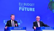 EU Commissioner for the Budget Gunther Oettinger (L) is watched by European Commission President Jean-Claude Juncker (R) as he addresses a press conference to present the EU's next long-term budget, at the European Commission in Brussels, on May 2, 2018. 