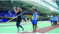 Olympic silver medallist Sandi Morris of the US demonstrating her pole vault skills to a schoolkid. 