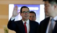 US Treasury Secretary Steven Mnuchin waves to the media as he and the U.S. delegation for trade talks with China, leave a hotel in Beijing, China May 3, 2018. REUTERS/Jason Lee