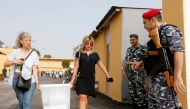 Government election officials carry a ballot box which will be located in polling stations ahead of the country's May 6 parliamentary election, in Beirut, Lebanon, May 5, 2018. REUTERS/Mohamed Azakir