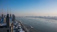 This January 9, 2018 photo shows the North Korean town of Sinuiju (R) opposite Dandong (L) in China's northeast Liaoning province. The dramatic diplomatic thaw on the Korean peninsula is sparking an unexpected economic windfall on the Chinese border, wher