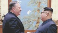 (FILES) In this file photo released by the US Government on April 26, 2018, North Korean leader Kim Jong-Un (R) shakes hands with the former CIA Director, now US Secretary of State, Mike Pompeo in Pyongyang over the 2018 Easter weekend. / AFP / US Governm