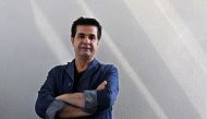 In this file photo taken on August 30, 2010 Iranian film director Jafar Panahi poses during an interview with AFP in Tehran.  AFP / Atta Kenare 