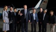 US President Donald Trump (C) speaks upon the arrival of US detainees Kim Dong-chul (4th R), Kim Hak-song (2nd R) and Tony Kim (3rd L) after they were freed by North Korea, at Joint Base Andrews in Maryland on May 10, 2018. AFP / SAUL LOEB