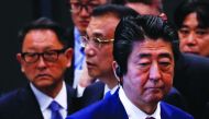 China's Premier Li Keqiang, Japan's Prime Minister Shinzo Abe and Toyota Motor Corp President Akio Toyoda visit a plant of Toyota Motor Hokkaido, Inc in Tomakomai, on Japan's northern island of Hokkaido, May 11, 2018. Reuters/Toru Hanai