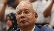Former Malaysian prime minister Najib Razak attends a press conference to announce his resignation as president of the United Malays National Organisation (UMNO), the main component party of the defeated Barisan Nasional (BN) coalition, in Kuala Lumpur on
