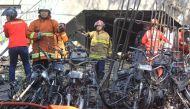 Firefighters are seen at the site of a blast at the Pentecost Church Central Surabaya (GPPS), in Surabaya, East Java, Indonesia May 13, 2018 in this photo taken by Antara Foto. Antara Foto/Moch Asim / via REUTERS 