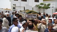 Pakistani mourners carry the coffin of hockey player Mansoor Ahmed during his funeral in Karachi on May 13, 2017. AFP / Rizwan Tabassum