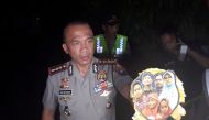 Chief of Surabaya Police, Rudi Setiawan, shows a family photo of suspected suicide bombers of the three churches in Surabaya, following a raid at their home in Surabaya, East Java, Indonesia, May 13, 2018 in this photo taken by Antara Foto. Antara Foto/Na