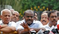 HD Kumaraswamy (C), Janata Dal (Secular) leader and former Chief Minister of the southern state of Karnataka, speaks with the media after handing over a letter of support from elected legislators to the state governor, outside the governor's house in Beng