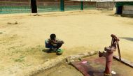 This photo taken on May 10, 2018 shows a Rohingya man preparing to make an offering for afternoon prayers at a refugee camp in Ukhia, Cox's Bazar. AFP / Munir Uz Zaman