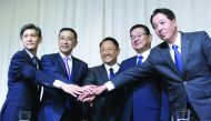Newly appointed Chairman of Japan Automobile Manufacturers Association (JAMA) Akio Toyoda (C) who is also President of Toyota Motor Corp., and vice chairmen representing Japan's automobile manufacturers pose for a photograph after a news conference in Tok