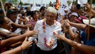 Mexico's presidential candidate for the MORENA party, Andres Manuel Lopez Obrador, greets supporters during a meeting at San Marcos community, in Guerrero State, Mexico on May 17, 2018. AFP / FRANCISCO ROBLES