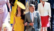US actor George Clooney and his wife, British human rights barrister Amal Clooney arrive for the royal wedding ceremony of Britain's Prince Harry and Meghan Markle at St George's Chapel in Windsor Castle in Windsor, Britain, May 19, 2018. LAUREN HURLEY/Po