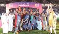 Al Duhail players and officials celebrate after winning the 2018 Amir Cup final at the Khalifa International Stadium in Doha yesterday. Pictures: Abdul Basit / The Peninsula  