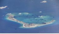 File photo of Chinese dredging vessels purportedly seen in the waters around Mischief Reef in the disputed Spratly Islands in the South China Sea in this still image from video taken by a P-8A Poseidon surveillance aircraft provided by the United States N
