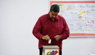 :Venezuela's President Nicolas Maduro casts his vote at a polling station, during the presidential election in Caracas, Venezuela May 20, 2018. REUTERS/Carlos Garcia Rawlins
