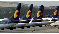 Jet Airways aircraft stand on tarmac at the domestic airport terminal in Mumbai, India September 9, 2009. Reuters/Punit Paranjpe