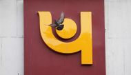 A pigeon flies past the logo of Punjab National Bank outside a branch of the bank in New Delhi, India, February 15, 2018. (Reuters / Adnan Abidi) 