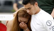 Mourners pray at a makeshift memorial left in memory of the victims killed in a shooting at Santa Fe High School in Santa Fe, Texas, U.S., May 21, 2018. Reuters/Jonathan Bachman