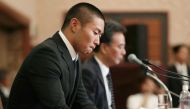 Japanese university American footballer Taisuke Miyagawa attends a press conference in Tokyo on May 22, 2018, to apologise for smashing into an opposition quarterback from behind during a match earlier this month. Japan OUT / AFP / JIJI PRESS / JIJI PRESS