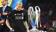 Liverpool's German goalkeeper Loris Karius walks past the trophy after losing the UEFA Champions League final football match between Liverpool and Real Madrid at the Olympic Stadium in Kiev, Ukraine, on May 26, 2018. / AFP / FRANCK FIFE