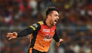 (FILES) In this photograph taken on May 25, 2018 Sunrisers Hyderabad cricketer Rashid Khan celebrates after taking the wicket of Kolkata Knight Riders cricketer Andre Russell during the 2018 Indian Premier League(IPL) Twenty20 second Qualifier cricket mat