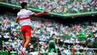 Serbia's Novak Djokovic plays a return to Brazil's Rogerio Dutra Silva during their men's singles first round match on day two of The Roland Garros 2018 French Open tennis tournament in Paris on May 28, 2018. AFP / Christophe Simon
